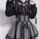 Black Jirai Kei Clothing Set: A black top and skirt outfit with lace, ruffles, and a corset belt.