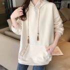 Cream colored Ethno-Chic Hoodie with embroidered details and drawstrings.