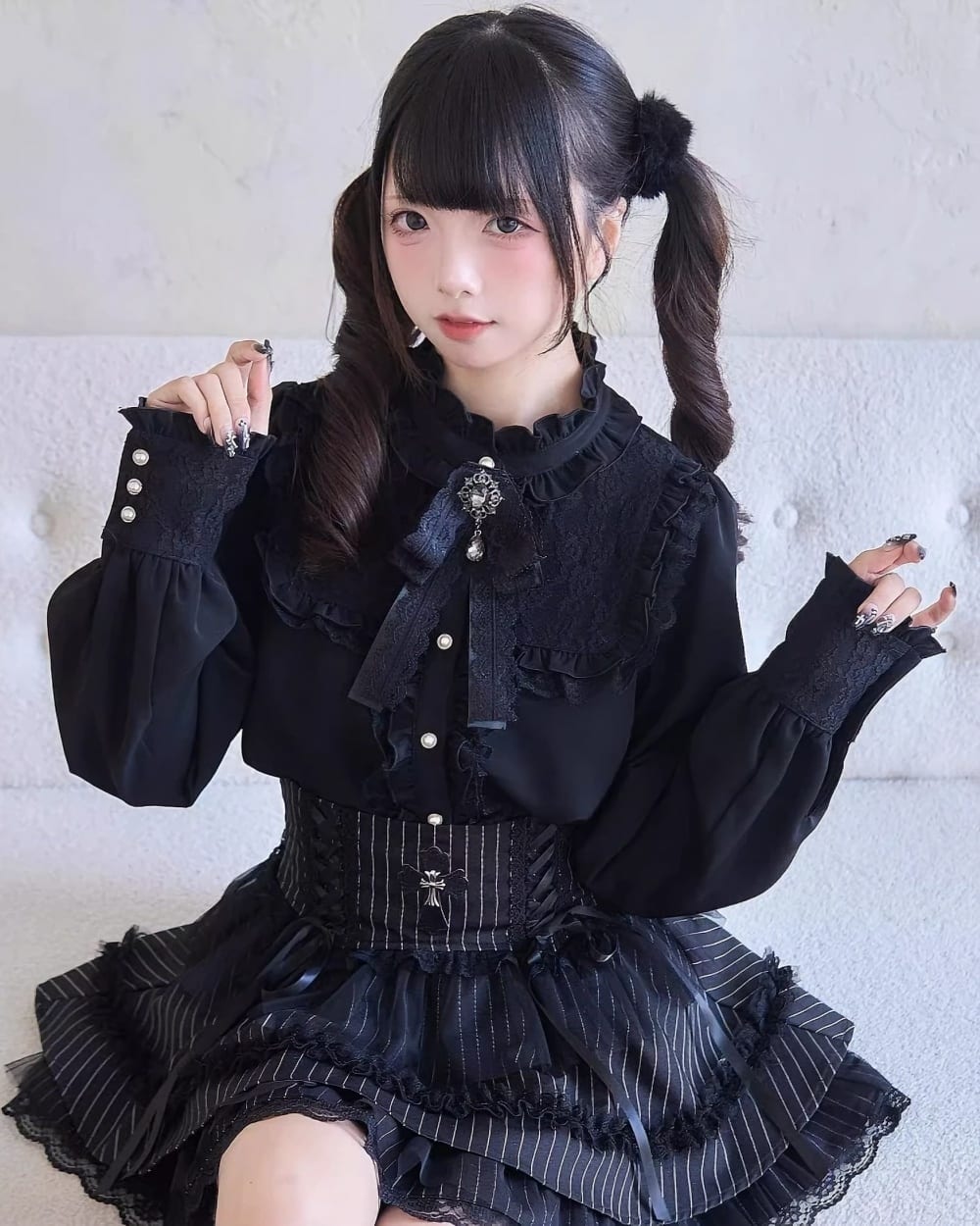 Model wearing a Dark Lolita Set - black blouse, skirt, and corset with lace details.