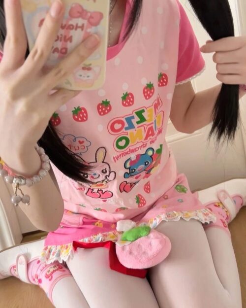 Mezzo Piano Strawberry T-Shirt featuring strawberry and bunny motifs on a pink background.