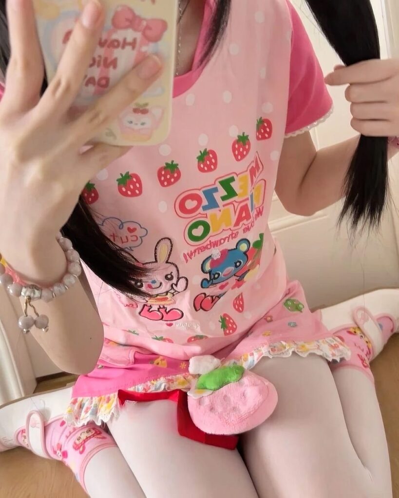 Mezzo Piano Strawberry T-Shirt featuring strawberry and bunny motifs on a pink background.