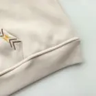 Close-up of an Ethno-Chic Hoodie sleeve detail, featuring ribbed cuffs and embroidery.