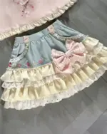 Lolita Skirt Top Set featuring a layered, ruffled skirt and matching top with bows.