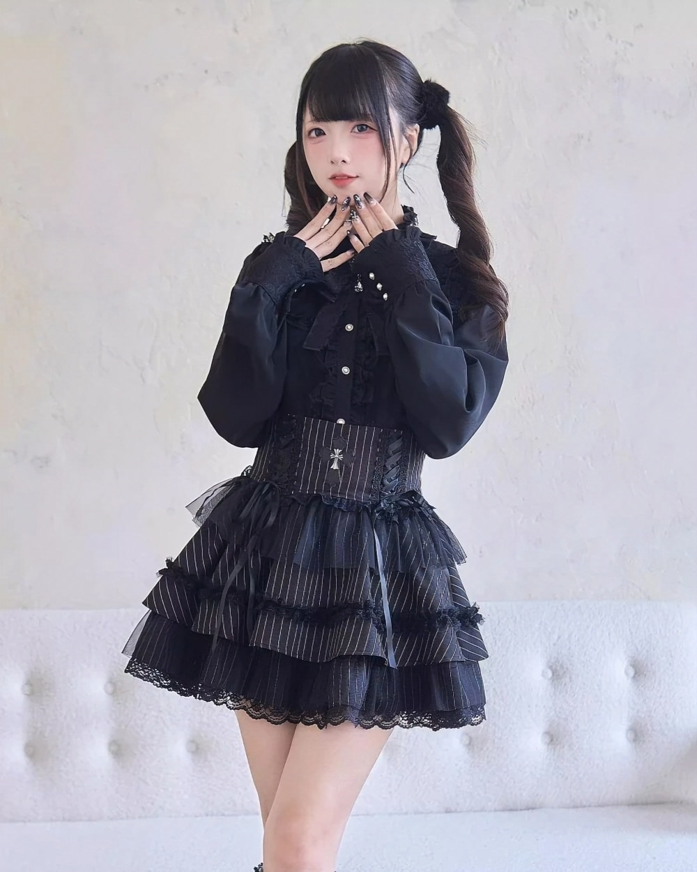 Model wearing a **Dark Lolita Set** – black ruffled blouse, corset, and skirt with lace trim.