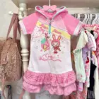 Mezzo Piano Hooded T-Shirt - Jojifuku Aesthetic, featuring a pink design with musical notes and character illustrations.