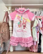 Mezzo Piano Hooded T-Shirt - Jojifuku Aesthetic, featuring a pink design with musical notes and character illustrations.