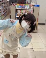 Model wearing a Kawaii Panda Pastel Long Sleeve T-Shirt from Jojifuku Aesthetic.