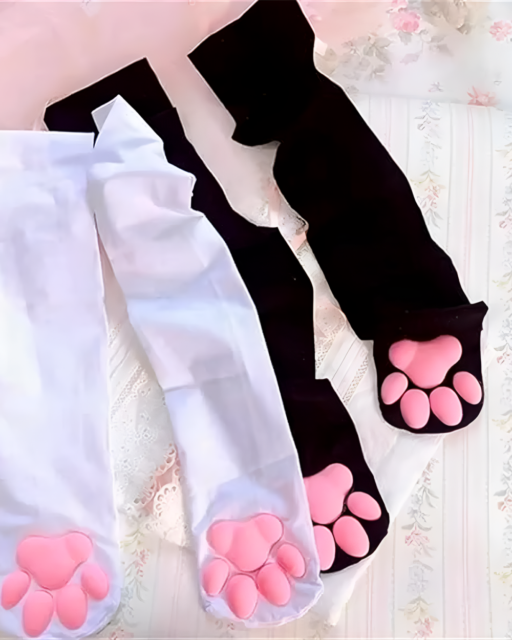Black and white 3D cat paw socks with pink paw pads. Over the knee (OTK) style socks.
