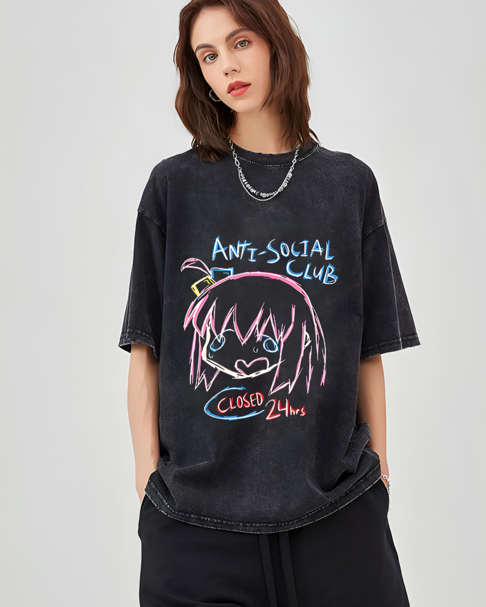 Woman wearing a black Bocchi shirt from Anti-Social Club's collection. Distressed graphic tee.