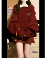 Woman wearing Autumn Red Set, a cozy red knit sweater and skirt, embodying a classic preppy aesthetic set.