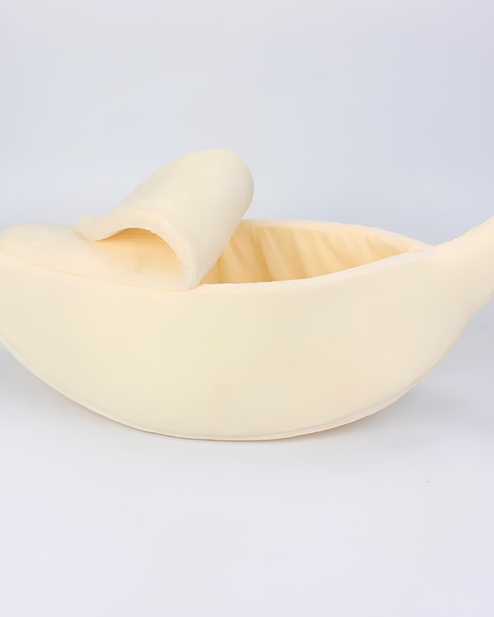 Close-up of a yellow cute cat beds shaped like a banana.