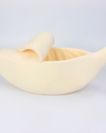 Close-up of a yellow cute cat beds shaped like a banana.