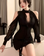 Black Coquette Dress - A black, sheer dress with a high neck and open sleeves.