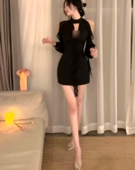 Black Coquette Dress - a black, hollowed-out, short dress with lace detailing.