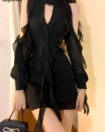 Black Coquette Dress featuring a hollowed-out design and ruffled sleeves.