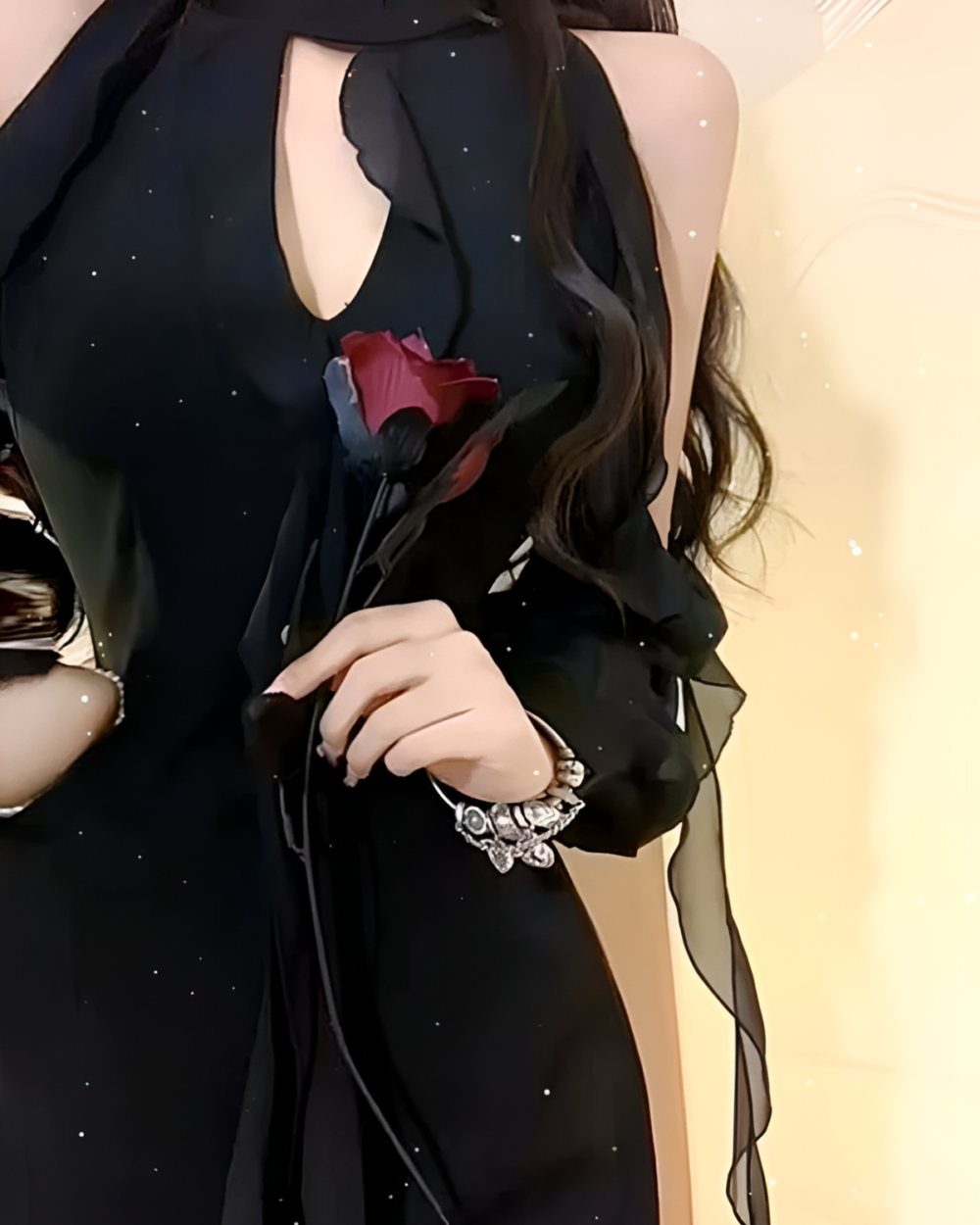 Black Coquette Dress featuring a cutout design and a rose accessory.