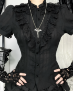 Black ruffled blouse featuring gothic aesthetic details and lace trim.