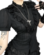 Black ruffled gothic aesthetic blouse with lace details and silver necklace.