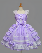 Purple Hime Lolita dress with ruffled details and lace trim, displayed on a mannequin. The Bloom Princess JSK features a bow at the waist.