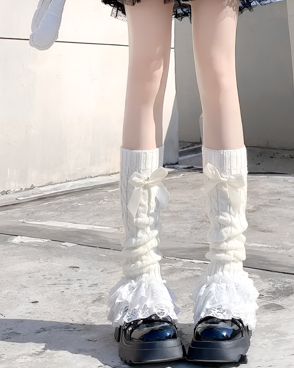 White ruffled leg warmers with bows, Hime Gyaru aesthetic style.