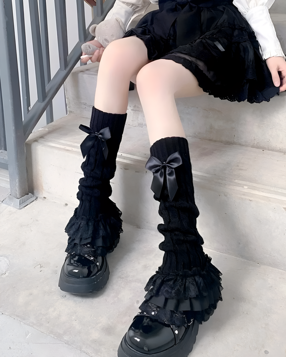 Black ruffled leg warmers with bows, Hime Gyaru aesthetic style.