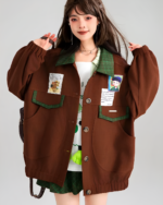 Brown corduroy jacket with patches and buttons, preppy style.