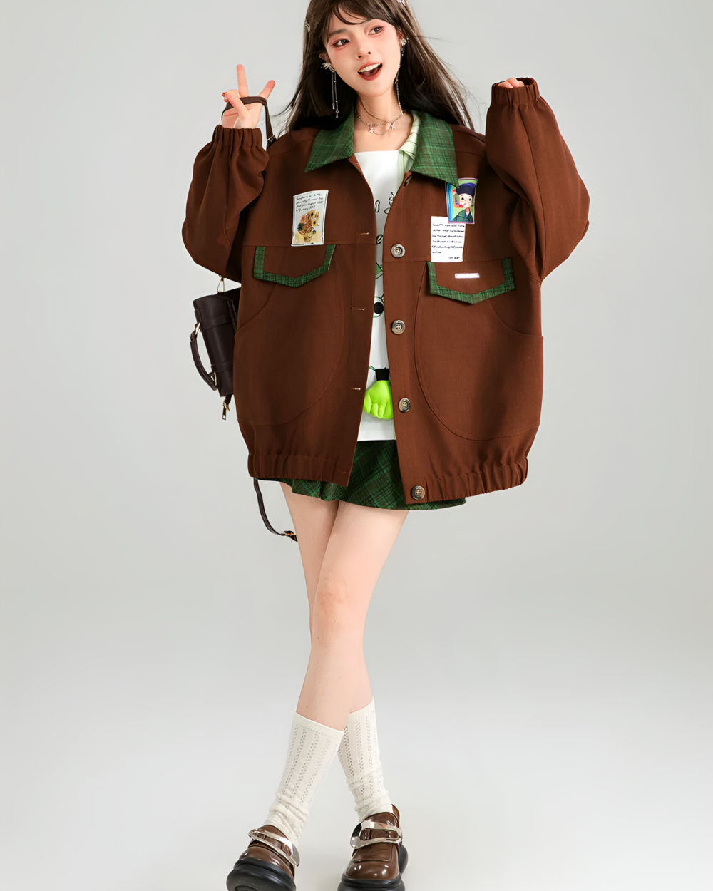 A brown corduroy jacket worn by a woman with patches and accessories.