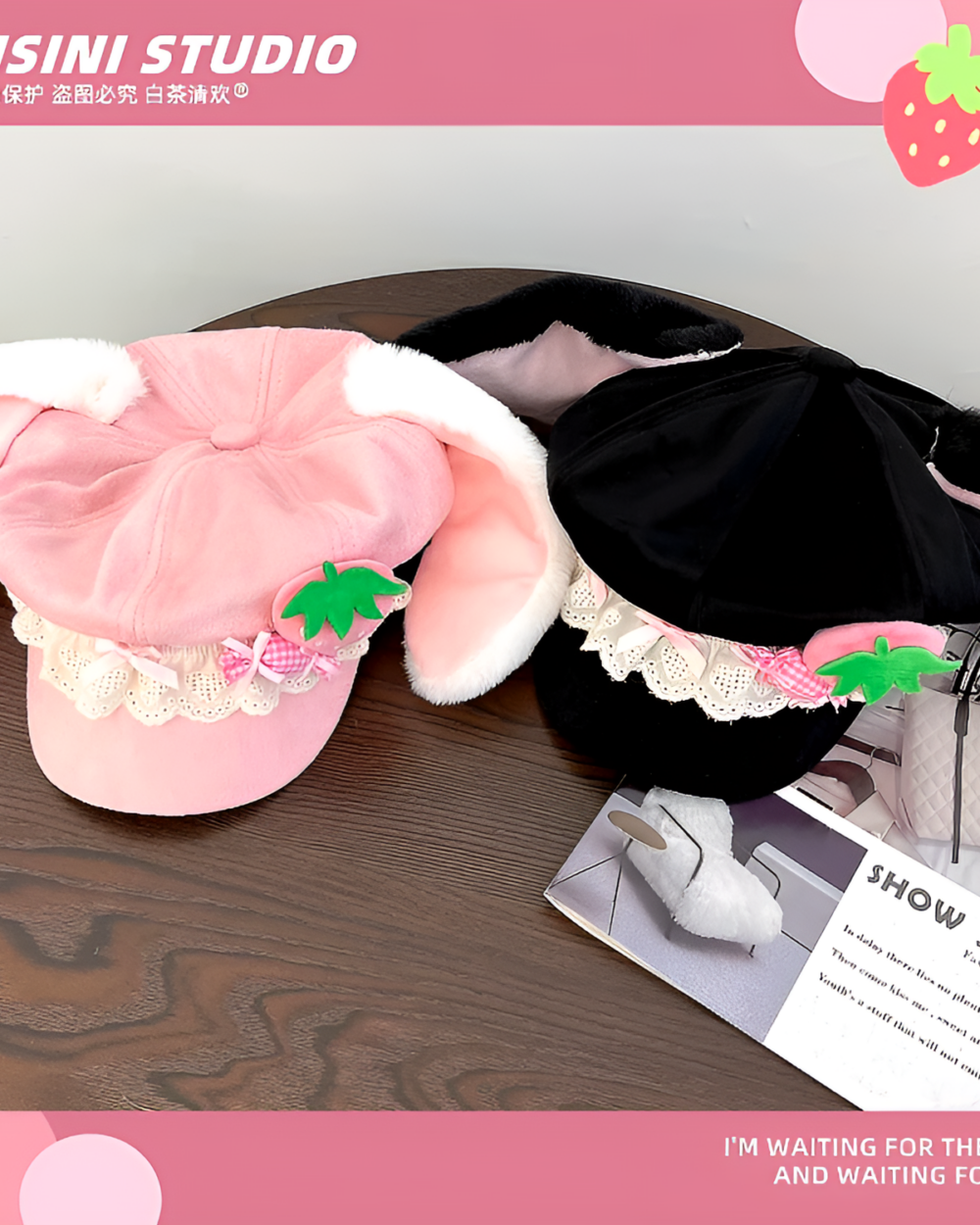 COISINI STUDIO strawberry bunny cap, black and white with pink accents and a strawberry decoration.