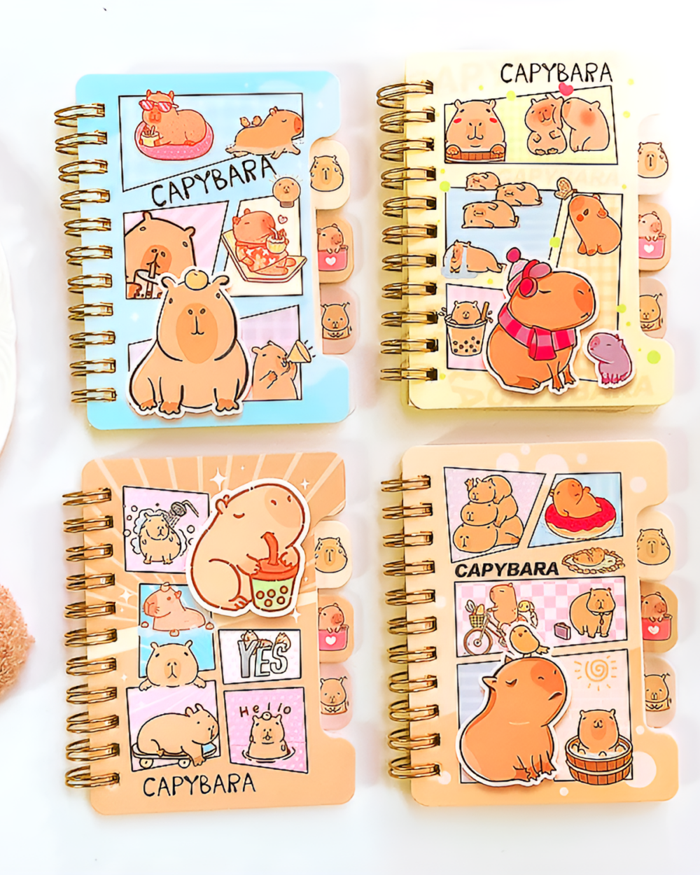 Set of Capybara Notebook Collection spiral notebooks with cute illustrations.