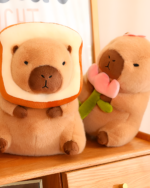 Two capybara plushies, one wearing a bread slice costume and holding a flower. Featuring the Capybara Plushies - Nature Explorer Edition.