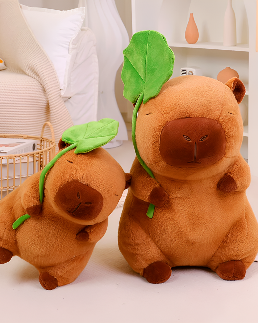 Two Capybara Plushies - Nature Explorer Edition with leafy hats. Soft, brown capybara plushie toys.