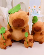 Three Capybara Plushies - Nature Explorer Edition shown in varying sizes. Brown stuffed animals with green sprout details.
