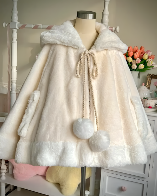 White Cat Eared Winter Cloak with fluffy trim and a tie closure, displayed on a mannequin.