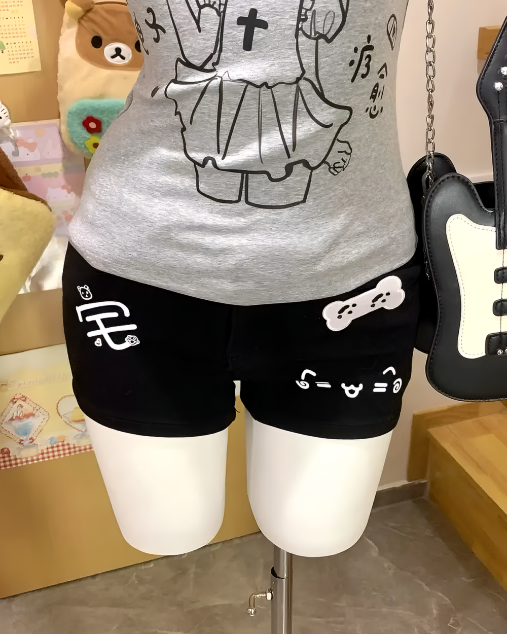 Cat Girl Nurse T-Shirt featuring a gray shirt with character and bone illustrations.