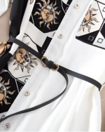Close-up of the Celestial Dress - Witchcore Aesthetic, featuring a sun and moon pattern. This celestial witchcore dress has black and white details.