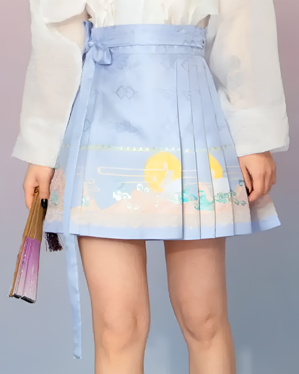 Close-up of a woman wearing a light blue celestial pleated skirt with a sun and moon design. The skirt features pleats and a tie waist.