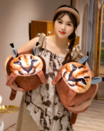 Chonky Big Floppa plushie being held by a woman.