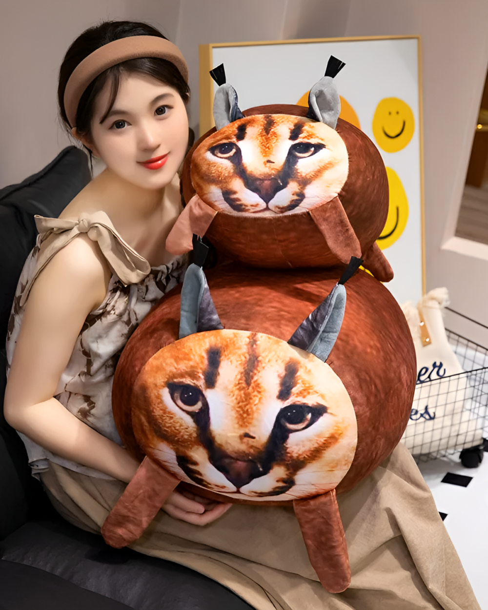 Chonky Big Floppa plushie resting on a woman's lap.
