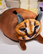 A brown Chonky Big Floppa plushie with realistic details.