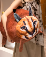 Chonky Big Floppa plushie, a large, round stuffed cat with printed face.