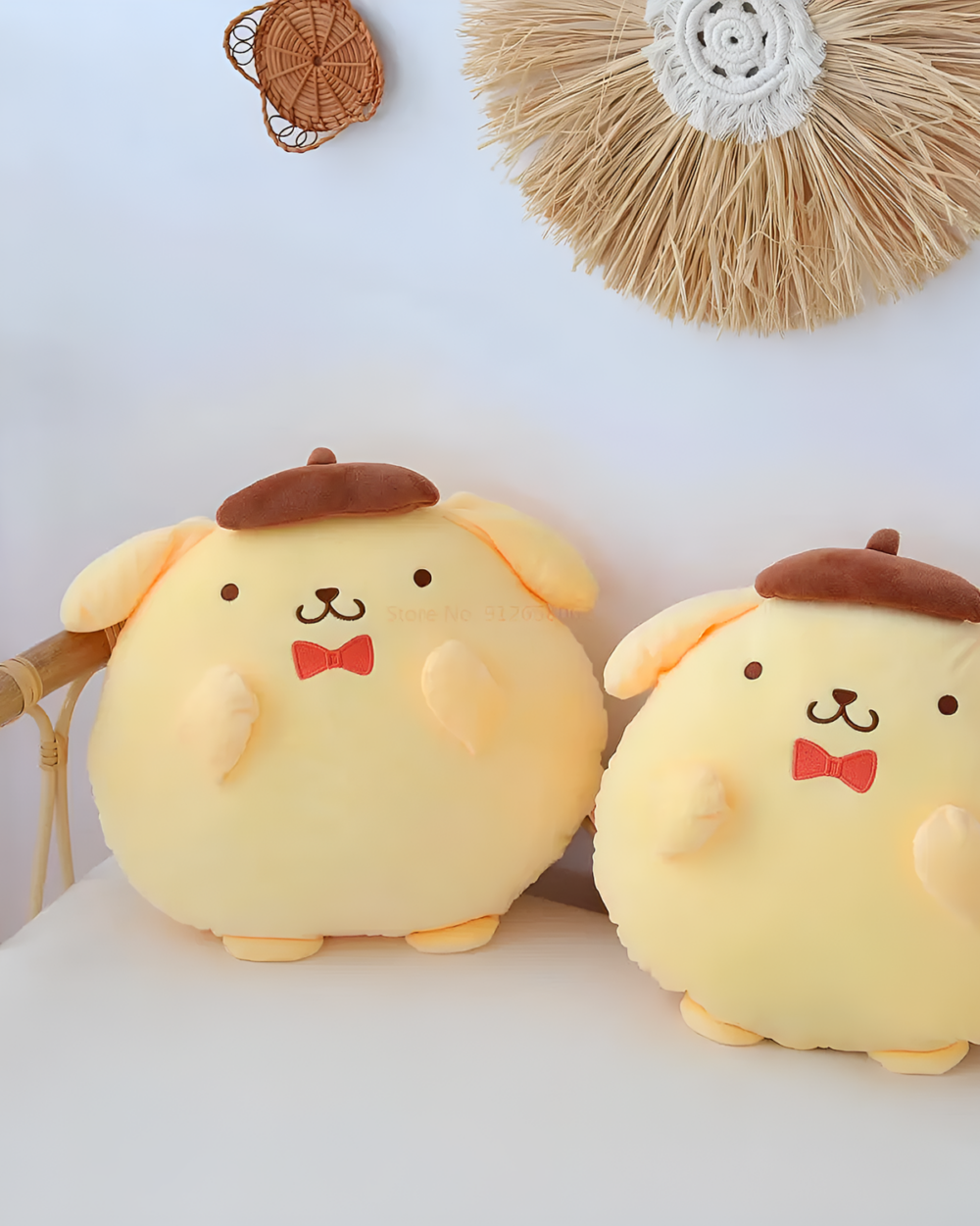 Two Chonky Purin Plushies with berets and bow ties are displayed against a textured wall.