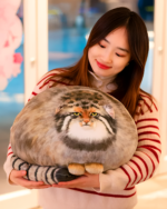 Chonky Realistic Palla's cat plush being held by a woman.