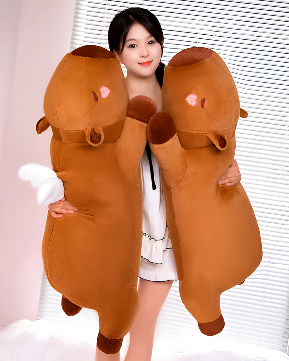 Woman hugging two brown Chonky Sleeping Capybara Plushies. Soft, oversized capybara plushie for cuddling and decoration.