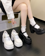 Black and white Chunky Mary Janes with platform heels and ankle buckle. Women's PU leather shoes in autumn style.