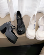 Black and white Chunky Mary Janes with thick platform heels. PU leather ankle buckle pumps for women, 2023 autumn style.