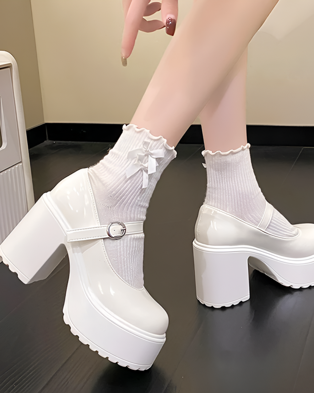 White Chunky Mary Janes with ankle buckle and platform heel, styled with white socks.