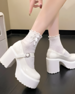 White Chunky Mary Janes with ankle buckle and platform heel, styled with white socks.