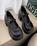 Black Chunky Mary Janes with a thick platform sole and ankle buckle. PU leather women's pumps, 2023 autumn style.
