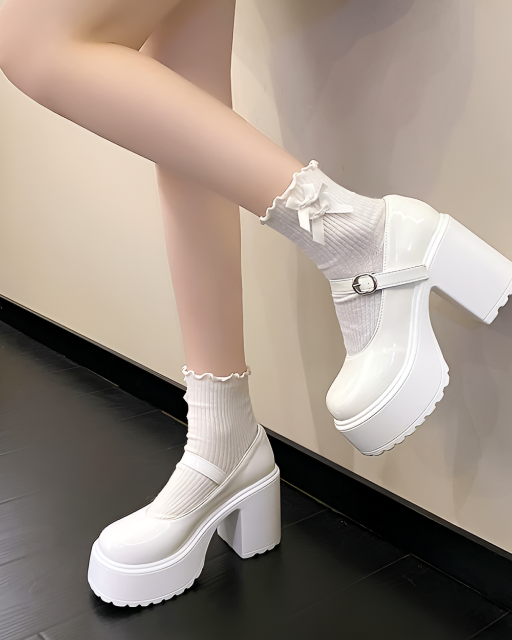 White Chunky Mary Janes with a thick platform heel and ankle buckle, paired with white socks. Women's Lolita shoes.