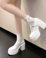 White Chunky Mary Janes with a thick platform heel and ankle buckle, paired with white socks. Women's Lolita shoes.